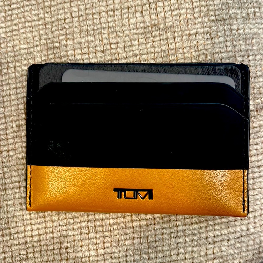 Black and tan card case by Tumi. Brand new.
